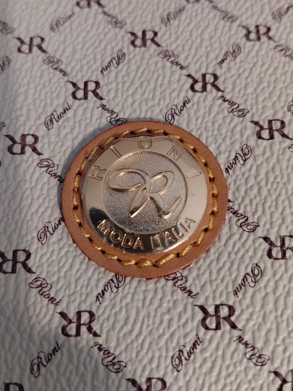 Rioni Cream Monogram Clutch with Gold Emblem